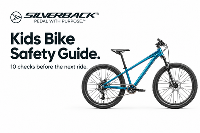 Metallic teal Silverback Spyke 26 youth bike beside the Kids Bike Safety Guide heading and Silverback Pedal With Purpose logo on a white background.