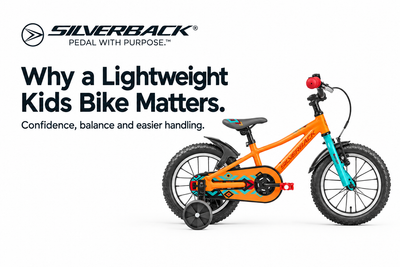 Orange Silverback Skid 14 kids bicycle with turquoise fork beside the Why a Lightweight Kids Bike Matters heading and Silverback logo on white.