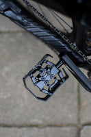 Xpedo Milo pedal mounted on a mountain bike – side view showing cage and cleat engagement