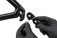 AI-generated servicing concept with gloved hands holding Hanger 3 beside a frame 2