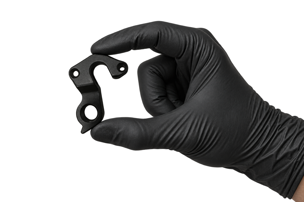 Small Hanger 23 held between fingertips 3