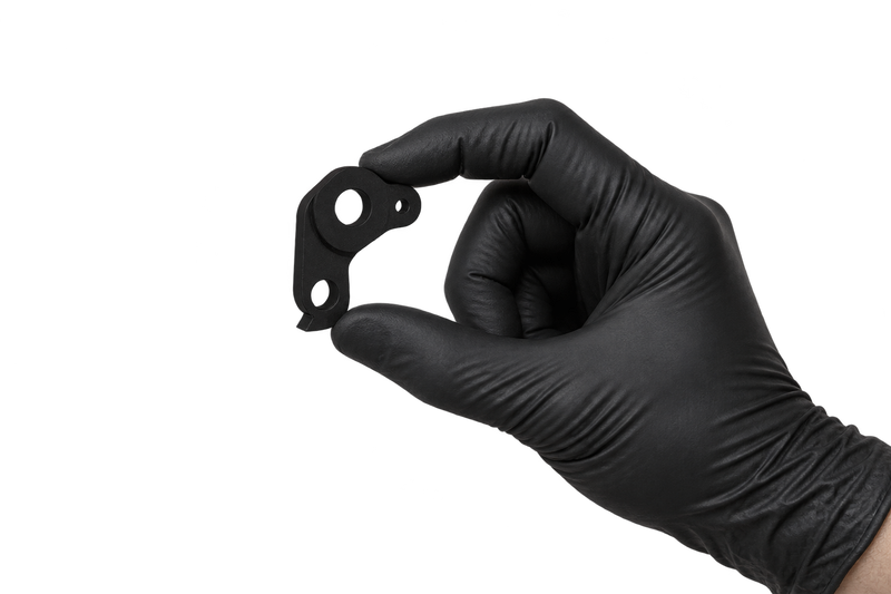 Small Hanger 28 held between fingertips
