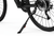 Close-up of a bicycle's rear wheel and black kickstand on a clean white background, showing the stand supporting the frame near the wheel hub.