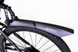 Lifestyle shot of a cyclist using the Speedkit Mudguard MTB universal in a muddy trail environment